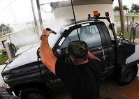 Tech. Sgt. Norman Hall, 919th Aircraft Maintenance Squadron, sprays down a bobtail truck May 1 at Duke Field.  Members of the squadron brought over regularly used vehicles to the wash rack for a much-needed cleaning.  (U.S. Air Force photo/Tech. Sgt. Samuel King Jr.)