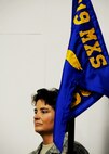 Senior Master Sgt. Madeline Reid, 919th Maintenance Squadron first sergeant, holds the guidon during the National Anthem at the squadron's change of command ceremony May 1 at Duke Field.  Maj. Kristoffer Payne took the reins of the squadron from Capt. Carmel Weed.  (U.S. Air Force photo/Tech. Sgt. Samuel King Jr.)
