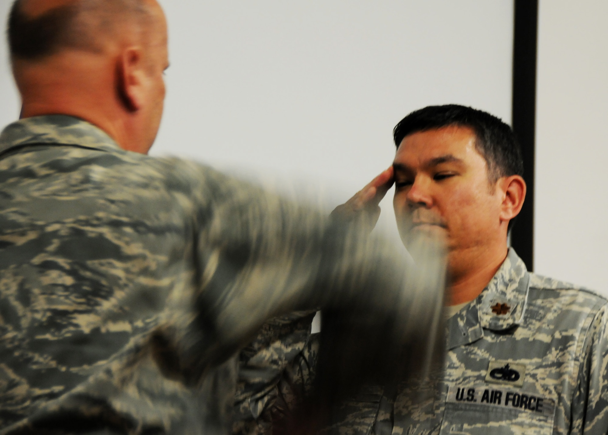 Maj. Kristoffer Payne salutes Lt. Col. Charles Middleton, 919th Maintenance Group vice commander, upon assuming command of the 919th Maintenance Squadron May 1 at Duke Field.  The major took the reins from Capt. Carmel Weed.  (U.S. Air Force photo/Tech. Sgt. Samuel King Jr.)
