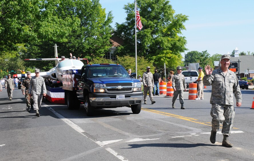 The 512th Airlift Wing Vice Commander Col. Michael T. Fitzhenry (far right) joined other wing members in participating in the Old Dover Days parade May 1 in historic Dover, Del. The Liberty Belle, T-37 aircraft, was also featured in the parade. In its 77th year, Old Dover Days offers a glimpse of the state capital and features a parade, maypole dancing, walking tours, entertainment, art, crafts and food. More than 1,800 reservists serve in the 512th AW, which flies the C-17 Globemaster III and C-5 Galaxy. The wing is the only Air Force Reserve unit in Delaware. (U.S. Air Force photo/Capt. Marnee A.C. Losurdo)