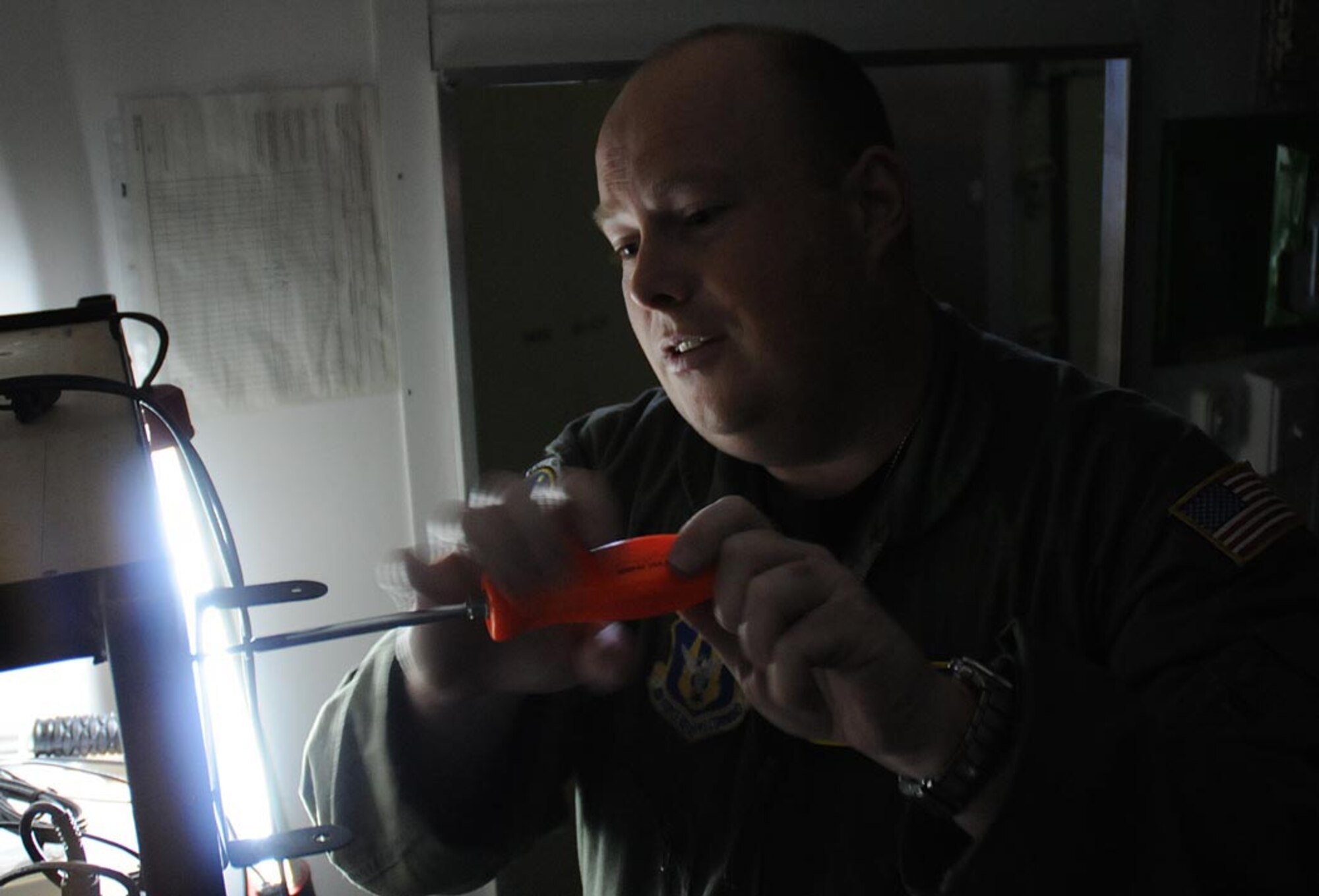 Master Sgt. Henry Fortney, 512th Airlift Control Flight loadmaster, uninstalls radios for transfer into new trailers in the 512th ALCF hangar bay here April 23. To accommodate technology, the 512th ALCF received three new trailers in January as part of an Air Force Reserve Command modernization effort. Functioning as small command and control packages, the trailers are intended for 12-hour operations in austere locations. One of the remodeling changes is space optimization. The new units will have affixed radios and a mounted radio mast. Also, the new trailers boast more power with two new electrical boxes and larger generator. The previously used models will be given to other units throughout the Reserve.  This project is expected to continue until July, 2010. (U.S. Air Force photo/Staff Sgt. James Bolinger)




