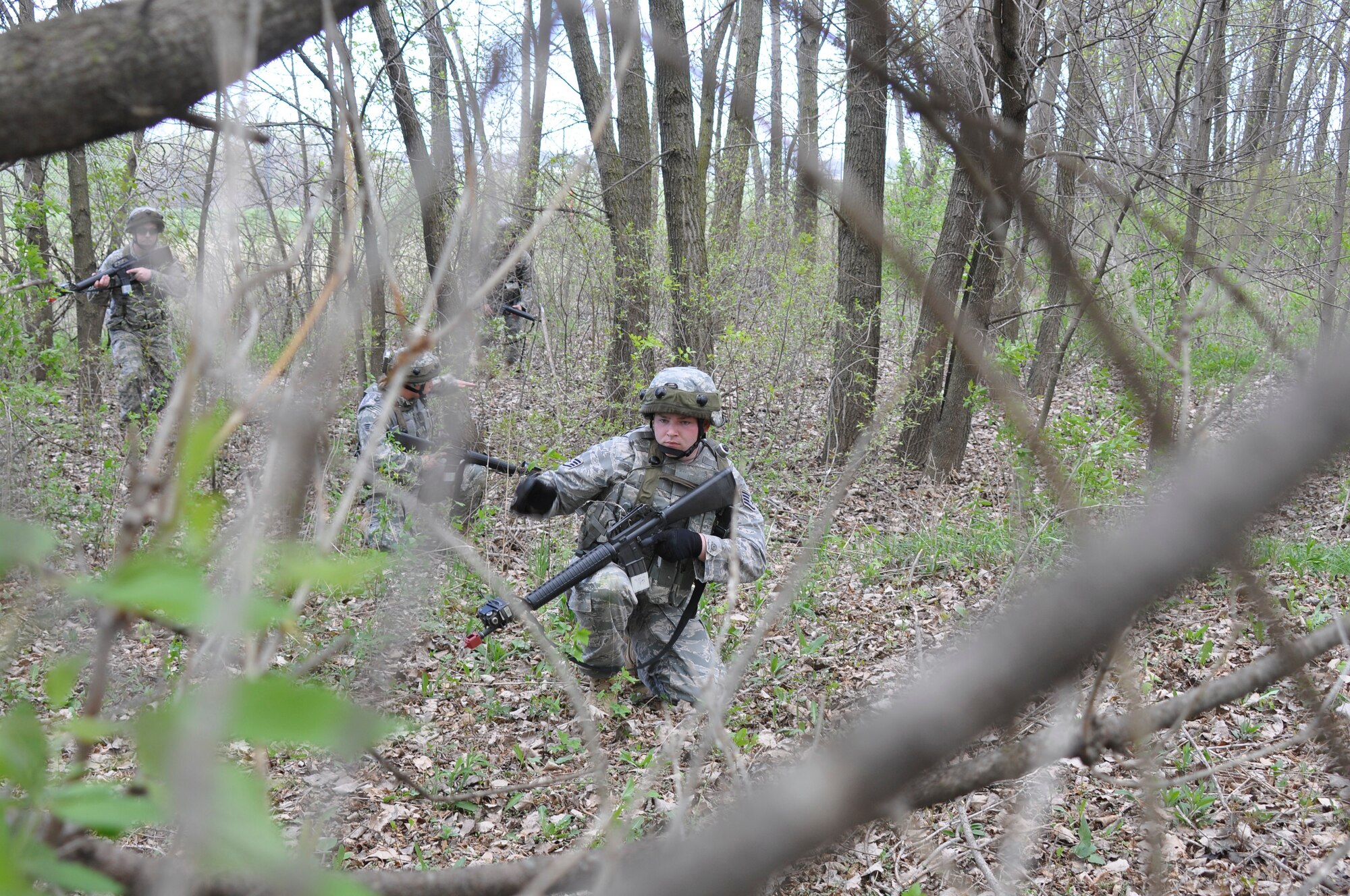 Staff Sgt. Cody Beran, a 128th Air Refueling Wing security forces team member, leads a combat patrol during an annual training exercise at Gen. Mitchell International Airport on Saturday, May 1, 2010.  The training reinforced land navigation and reactive fire techniques for security forces personnel, and it prepared the team members for their operations at home station and while deployed.  (U.S. Air Force photo by Staff Sgt. Jeremy Wilson/Released)