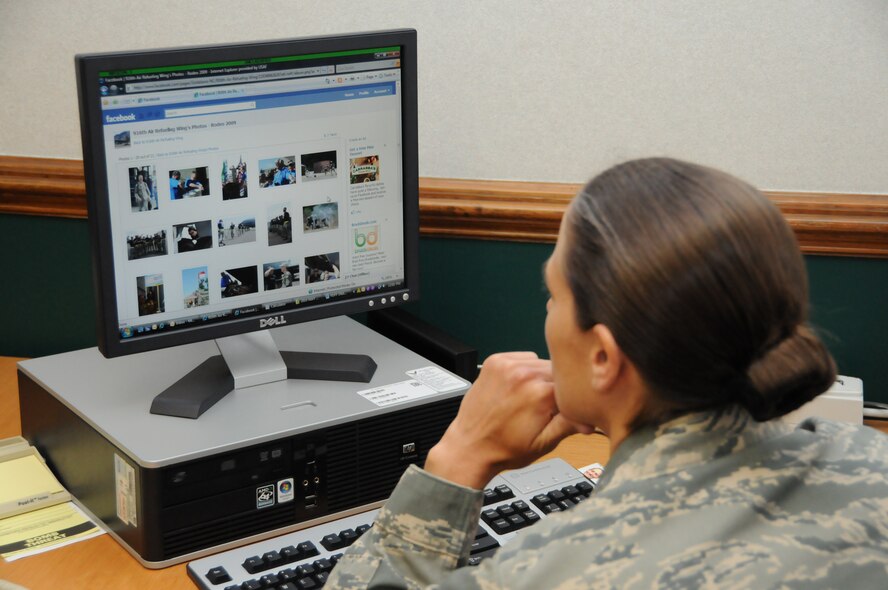 Master Sgt. Wendy Lopedote, of the 916th Public Affairs Office, checks her Facebook account during the May unit training assembly weekend. (USAF photo by TSgt. Scotty Sweatt, 916ARW/PA).
