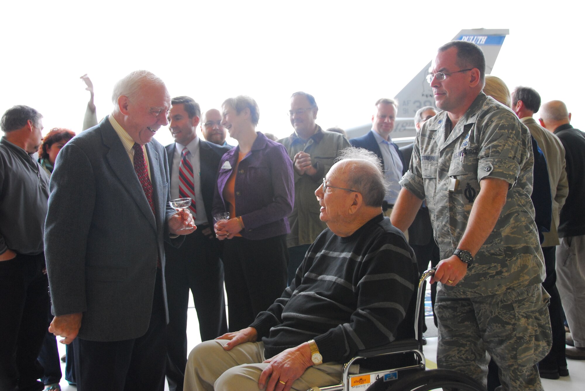 U.S. Rep. James Oberstar speaks with retired U.S. Air Force Col. John R. Hed, first 148th Fighter Wing commander, at a wing celebration ceremony at the Duluth, Minn., ANG Base April 30, 2010.  Past and present members of the unit, friends and family, along with state and local officials gathered at the wing to celebrate the arrival of the new block 50 F-16C aircraft. (U.S. Air Force photo by Master Sgt. Jason W. Rolfe/Released)