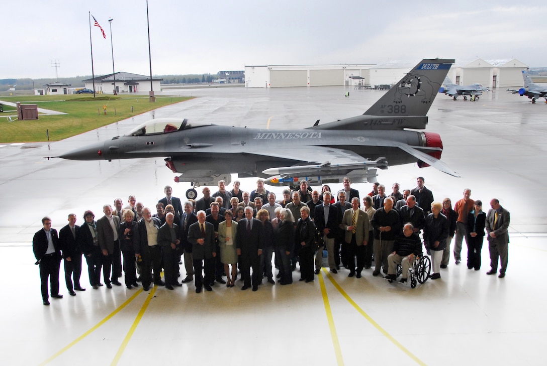 Distinguished guests of the 148th Fighter Wing pose in front of one of the wing's new F-16C Fighting Falcons at a wing celebration ceremony at the Duluth, Minn., ANG Base Apr. 30, 2010.  Past and present members of the unit, friends and family, along with state and local officials gathered at the wing to celebrate the arrival of the new block 50 F-16C aircraft. (U.S. Air Force photo by Master Sgt. Jason W. Rolfe/Released)