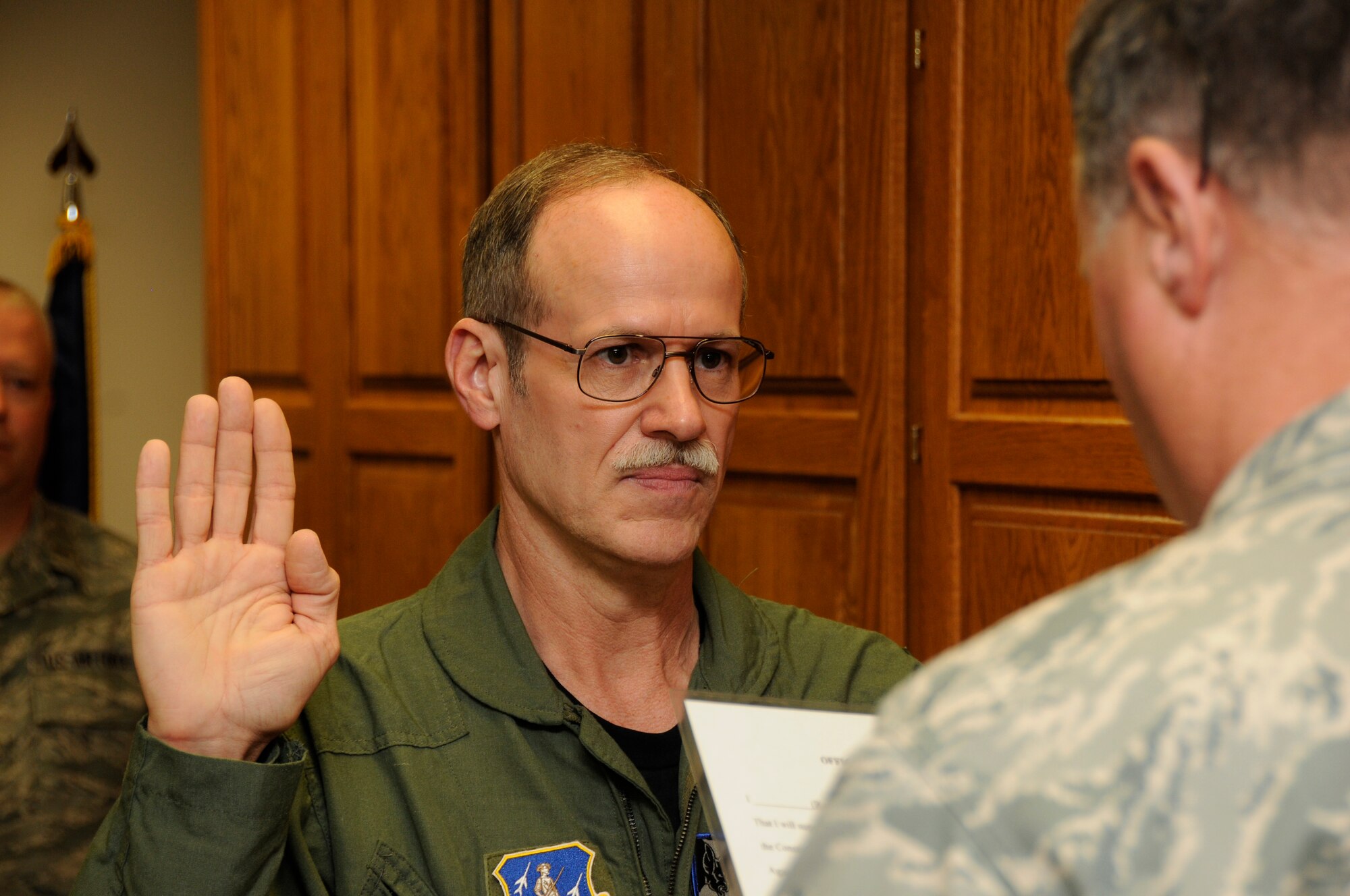 Dr. Glenn Harden, a Physician from Sioux City, Iowa is sworn into the Air National Guard at the 185th, Air Refueling Wing on May 1, 2010 in Sioux City, Iowa. Dr Harden will work as the flight surgeon here at the 185th ARW medical clinic.
Air Force Photo By: Tech Sgt Oscar Sanchez
