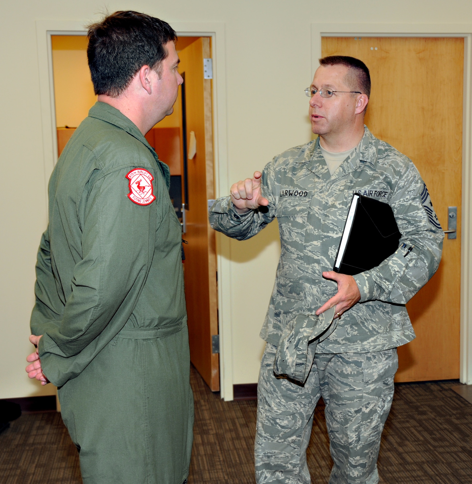 Chief Master Sgt. Steven Larwood (right), 22nd Air Force command chief, discusses enlisted developement issues with Master Sgt. Michael Randag, loadmaster instructor with the 815th Airlift Squadron. Chief Larwood visited the 403rd Wing April 30-May 2 to listen to the concerns of the unit's enlisted members.   