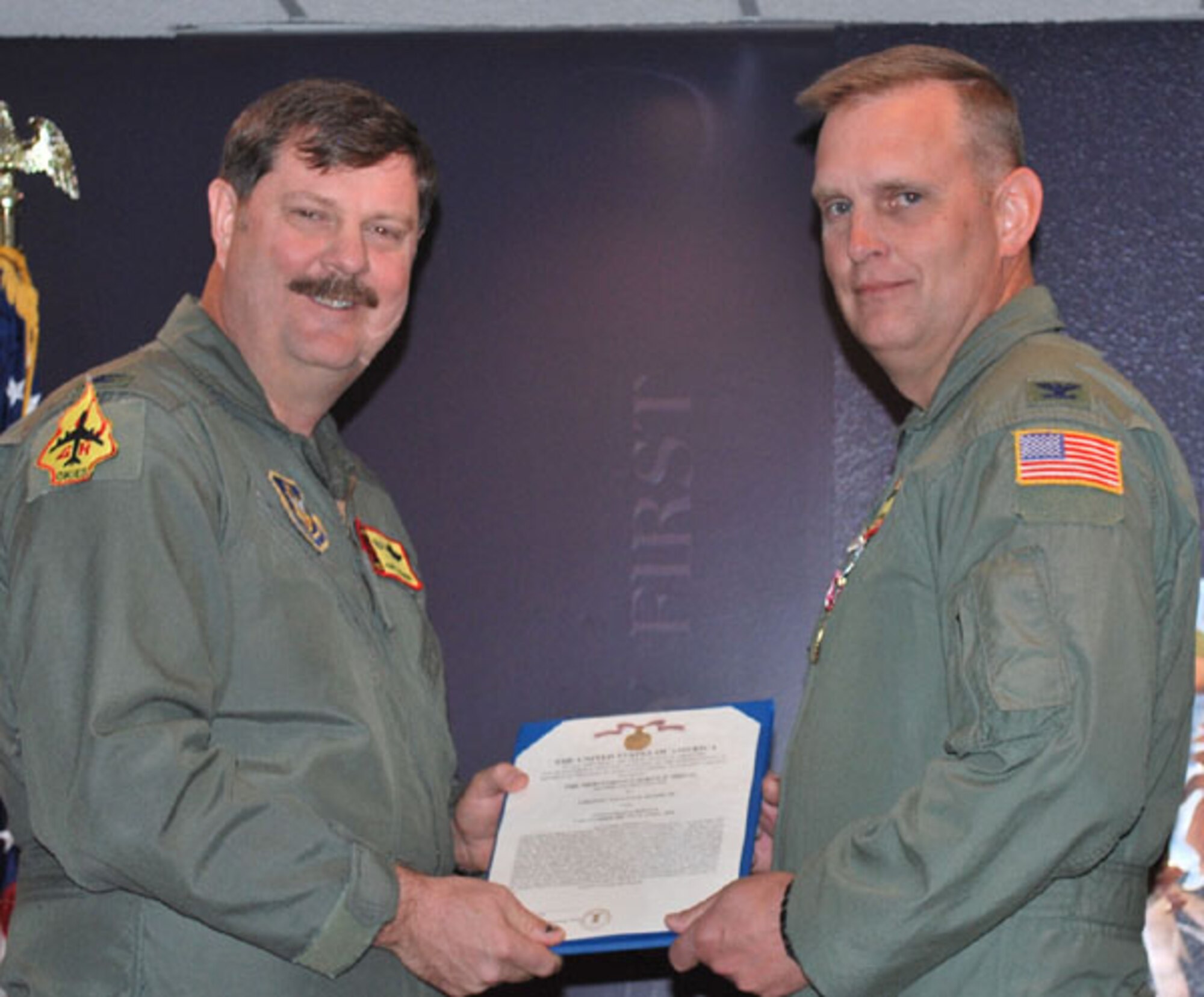 Col. William Mason, pictured with Col. Gregory Gilmour, is presented a
Meritorious Service Medal on April 10, 2010. He relinquished command of the 465th Air Refueling Squadron on April 10, in preparation for his new
assignment as commander of the 434th Operations Group, Grissom Air Reserve Base, Indiana. Mason is a Command Pilot with more than 5,300 hours. He has flown the
T-34C, T-2C, TA-4J, T-44A, E-6A,