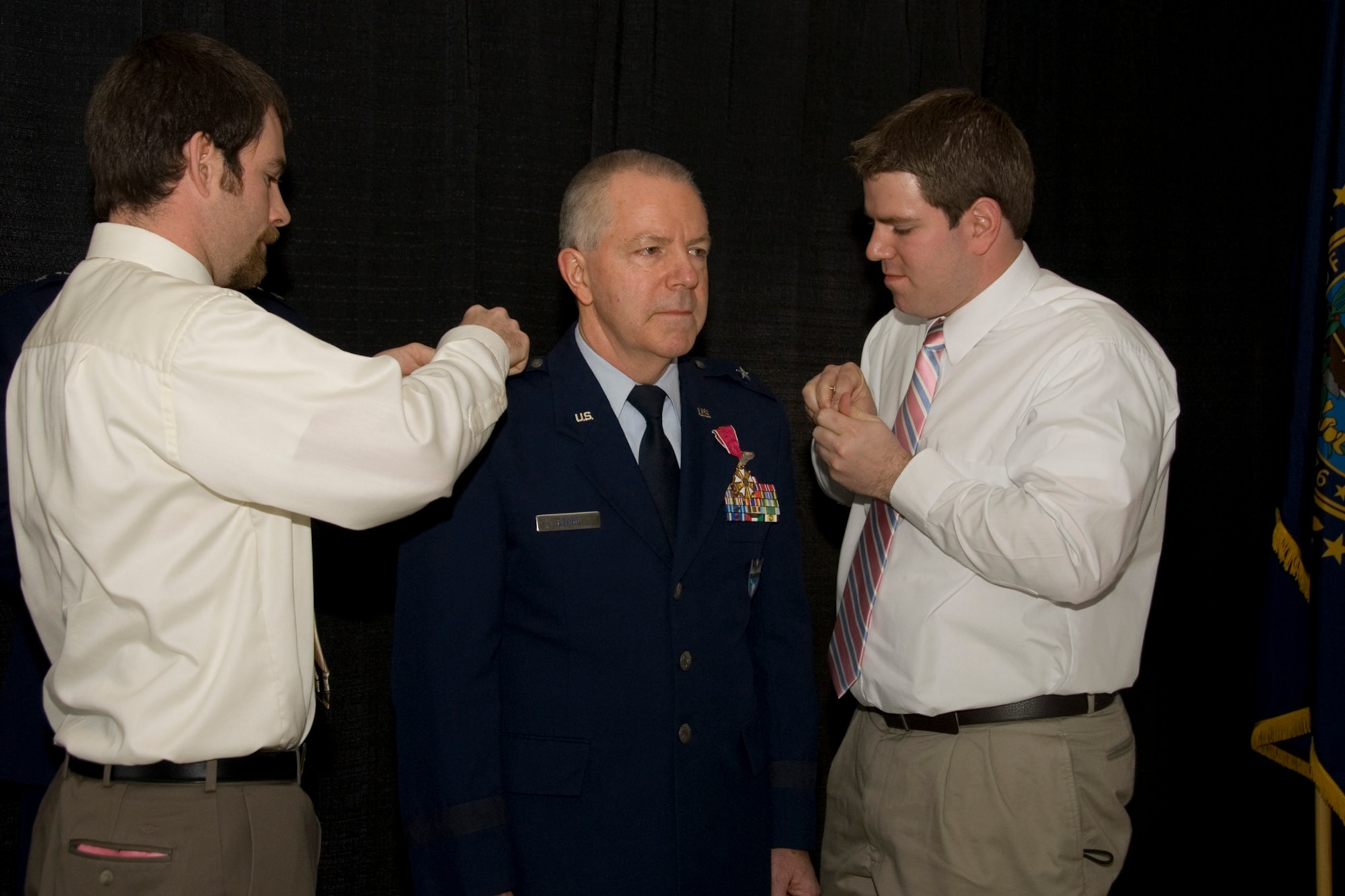 Ian Sears (left) and Adam Sears (right) help pin stars on their father, Major General Mark Sears during his promotion ceremony at Pease Air National Guard Base, New Hampshire on May 1, 2010. Sears, former Commander of the N.H.A.N.G. was recently promoted and is currently assigned as Deputy Commander for Mobilization and Reserve Affairs, United States Southern Command in Miami, Florida.  (U.S. Air Force photo/Staff Sgt. Curtis J. Lenz)