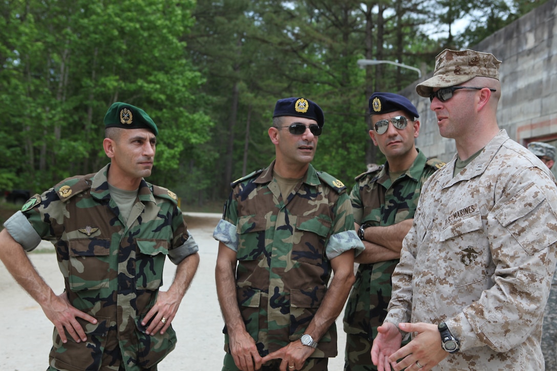 Capt. Scott Silva, operations officer with Marine Combat Training Battalion, School of Infantry-East, talks to officers with the Lebanese Armed Forces aboard Camp Devil Dog during an engagement visit to the United States, May 3.  Marine Corps Base Camp Lejeune was the first stop for these LAF officers who teamed up with officials from Marine Corps Forces Central Command to visit Marine Corps training facilities along the East Coast during their week-long visit to the U.S.