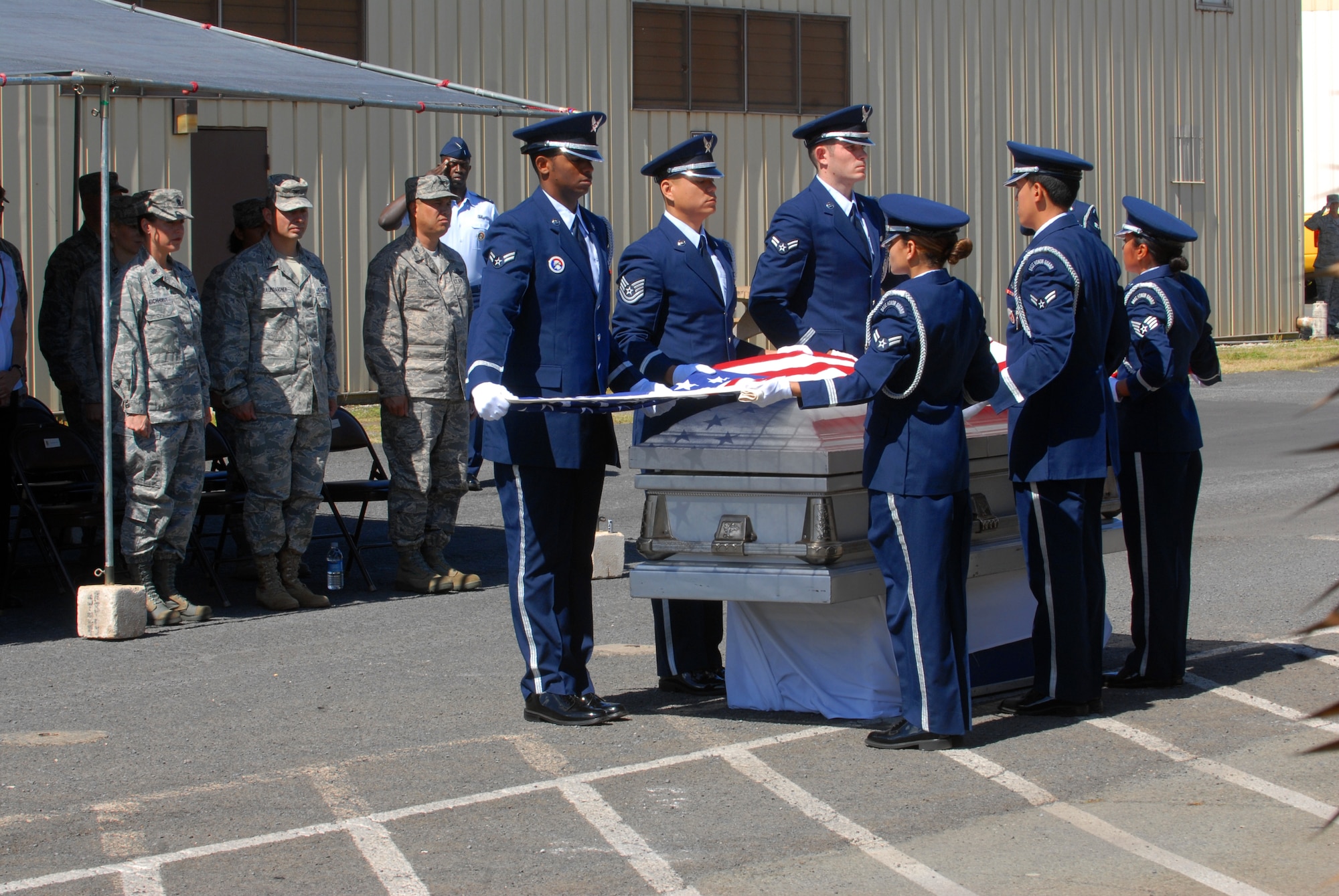 Hickam Honor Guard members demonstrate a funeral ceremony during the Hickam Honor Guard graduation here, April 27. The Hickam Honor Guard graduated 11 members this quarter. (U.S. Air Force photo/Senior Airman Gustavo Gonzalez)