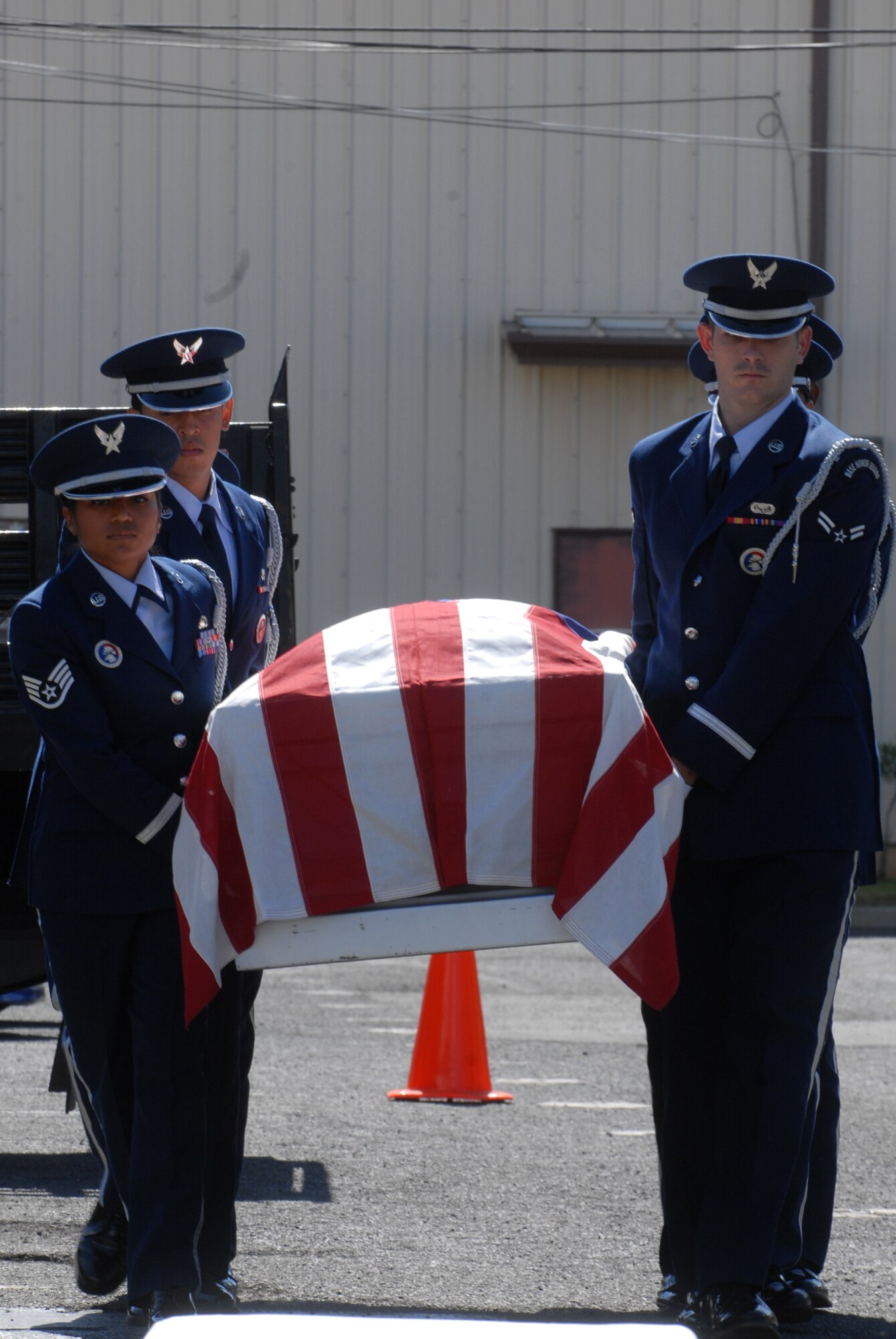 Hickam Honor Guard members demonstrate a funeral ceremony during the Hickam Honor Guard graduation here, April 27. The Hickam Honor Guard graduated 11 members this quarter. (U.S. Air Force photo/Senior Airman Gustavo Gonzalez)