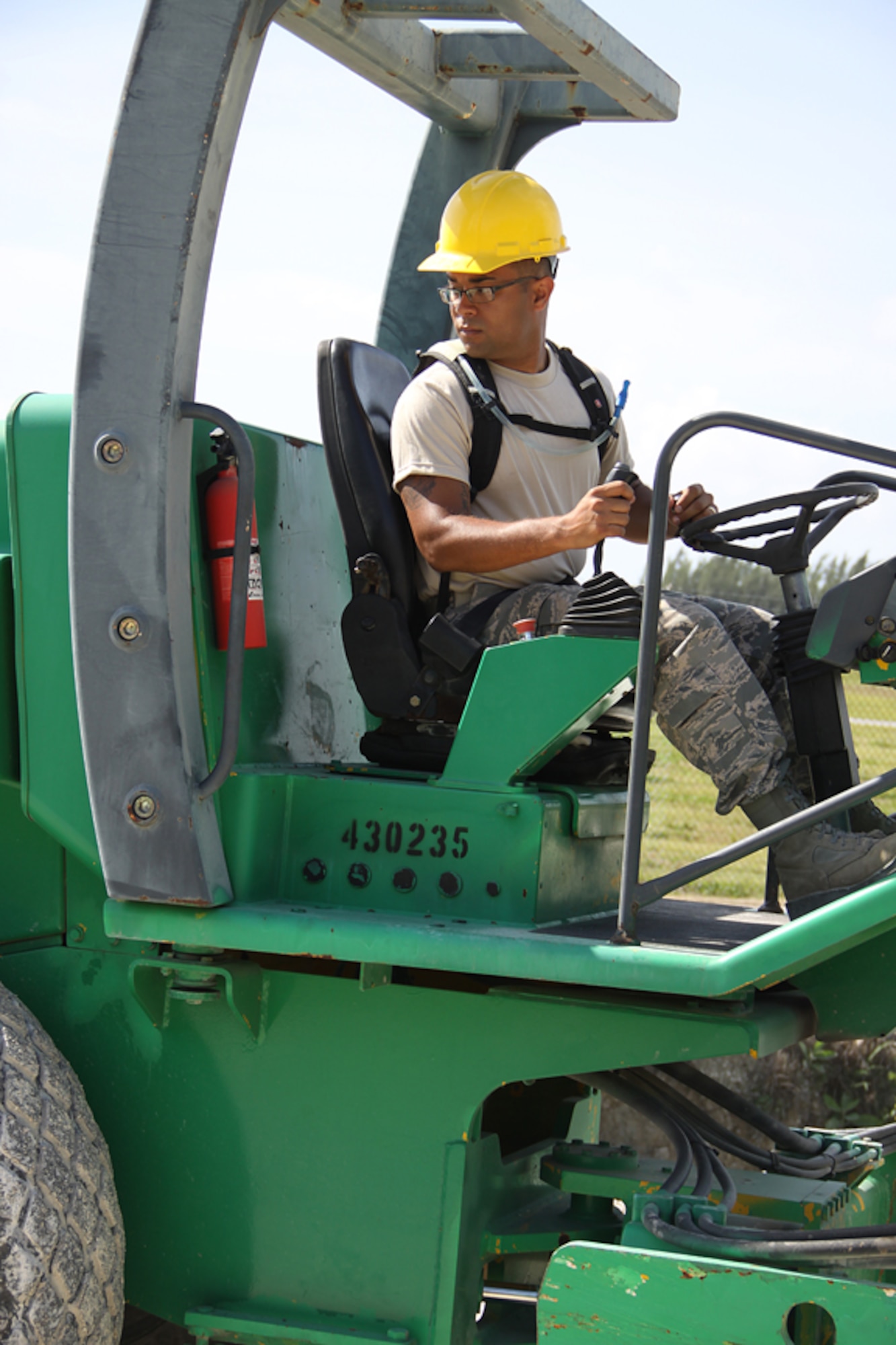 Senior Airman Luis Mateo, 482nd Civil Engineering Squadron heating, ventilation, & air conditioning apprentice, operates a roller in order to compact the newly added gravel to Homestead Air Reserve Base’s newest bridge on April 15. The month long project has given Homestead ARB a new emergency alternative route which will be a critical safety precaution for the 2010 Wings Over Homestead Air Show.  (U.S. Air Force photo/Senior Airman Lou Burton)