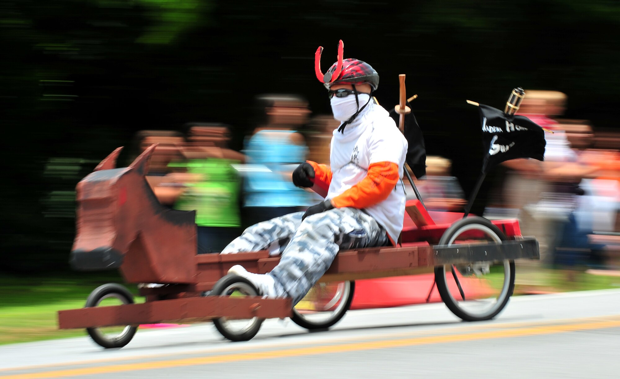 Soapbox derby racers descend Douglas Boulevard during the American Red Cross Derby Day May 1 at Kadena Air Base, Japan. The event raised $5,435 for the American Red Cross.  (U.S. Air Force photo/Tech. Sgt. Rey Ramon)   
