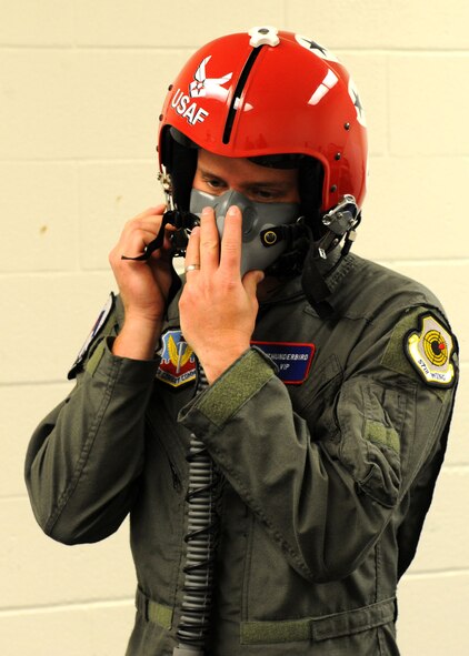 DYESS AIR FORCE BASE, Texas -  Abilene Police Officer and Hometown Hero Andy Adkins secures his oxygen mask before his honorary flight in a United States Air Force Thunderbirds F-16C Fighting Falcon here, April 29. The Hometown Hero program is designed to showcase Abilenians putting forth amazing effort in their community, in line with amazing efforts put forth by America's Airmen every day. Officer Adkins received community recognition when he volunteered his time and service to provide a unique opportunity for a special needs individual in the community. (U.S. Air Force photo/ Airman 1st Class Cheslea Browning)