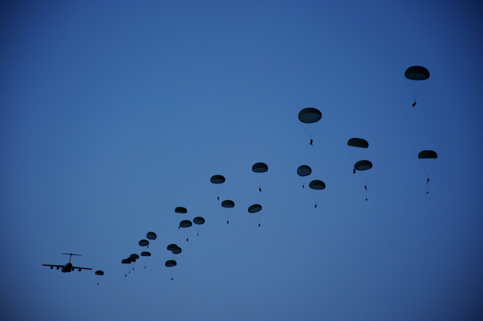 Soldiers with the 82nd Airborne Division at Fort Bragg, N.C., parachute from a C-17 Globemaster III aircraft April 28, 2010, during a joint forcible entry exercise over Fort Bragg.  The exercise provides the Soldiers with training for real-world contingency operations.  (U.S. Air Force photo/Staff Sgt. Kamaile O. Long)