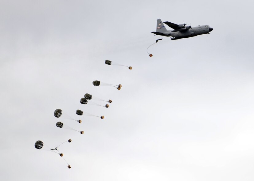 DYESS AIR FORCE BASE, Texas-- A C-130 Hercules drops cargo for spectators during the Dyess Big Country Airfest, here May 1. The airfest is held every other year on Dyess Air Force Base and features various aircraft performing as well as static displays. The airfest is held to bring the Abilene and Dyess communities together to demonstrate the capabilities of the Air Force. (U.S. Air Force photo/ Airman 1st Class Brittney Prescott)