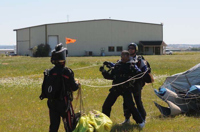 Airman 1st Class Isaiah Payne, with the 13th Intelligence Squadron, gives the thumbs up to a cameraman after his landing, April 30 at Lincoln Regional Airport. Airman Payne was skydiving as part of Beale’s “Jump into Prevention” for Sexual Assault Awareness month. (Air Force photo by Airman 1st Class David Tracy)