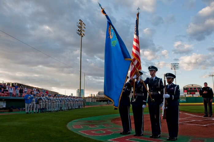 LAS VEGAS --  Nellis Air Force Base Honor Guard present the colors during the national anthem as the U.S. Air Force Academy "Falcons" baseball team looks on during the opening ceremonies of a three game set against the the University of Nevada, Las Vegas "Rebels,"  at Earl E. Wilson Stadium, in Las Vegas April 30, 2010. UNLV declared the weekend, Air Force weekend and offered free admission for all active duty during the Air Force Academy, UNLV baseball games.  (U.S. Air Force photo by Tech. Sgt. Michael R. Holzworth)