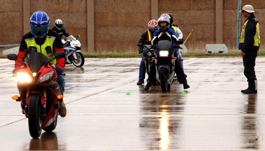 Participants in the Air Mobility Command Sport Bike Course await their turn to perform the sport bike training course April 30 at Grand Forks Air Force Base, N.D. The AMC Sport Bike Course is a requirement for all military (on and off the installation) and Department of Defense civilians (while on the installation) to operate a sport bike while assigned to an AMC unit. The training is an all day event and once certified the operator will remain certified for as long as they are assigned to an AMC unit or unless otherwise directed. (U.S. Air Force photo by Airman 1st Class Rachel Martinez)
