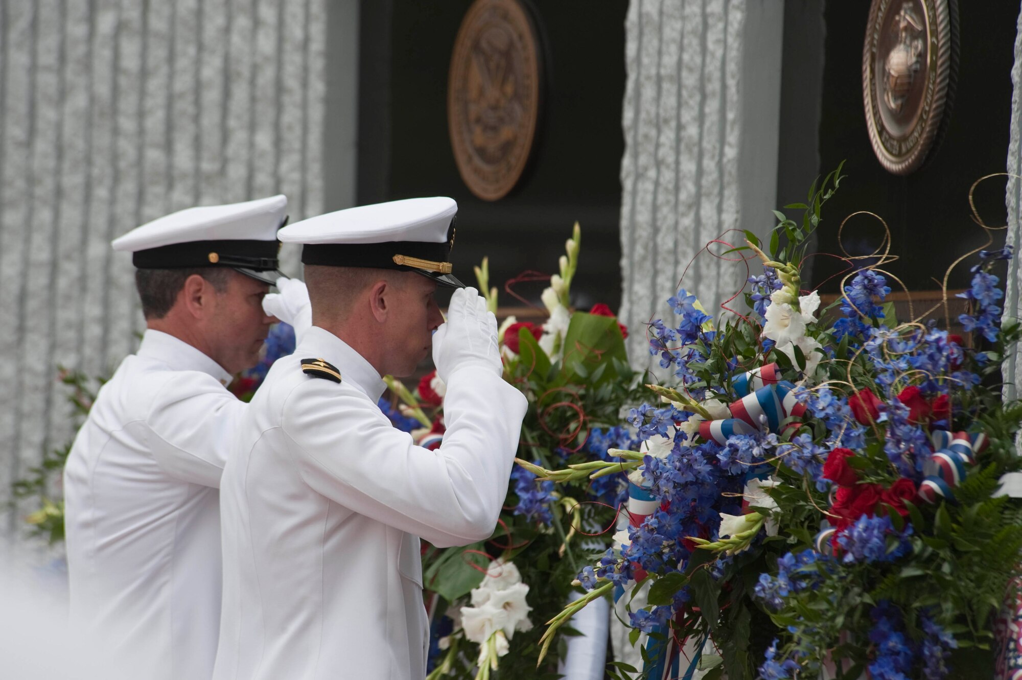 Lt. Commander Mark McGuckin and Command Master Chief James Walker honor fallen explosive ordnance disposal personnel during the 41st annual EOD Memorial Service May 1. (USAF photo/Greg Murry)