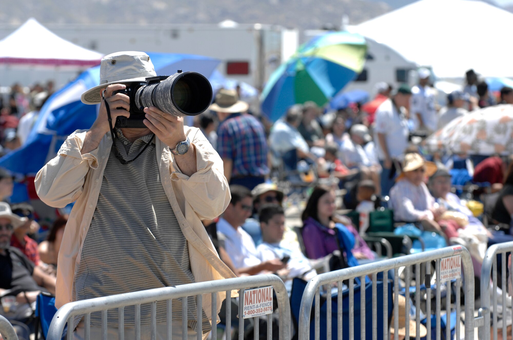 A photographer captures one of the aerial acts during March Field AirFest, March Air Reserve Base, Calif., May 1, 2010. March Field AirFest is a two-day event featuring performances and static displays of civilian and military aircraft. (U.S.  Air Force photo by Senior Airman Matthew Smith/Released)
