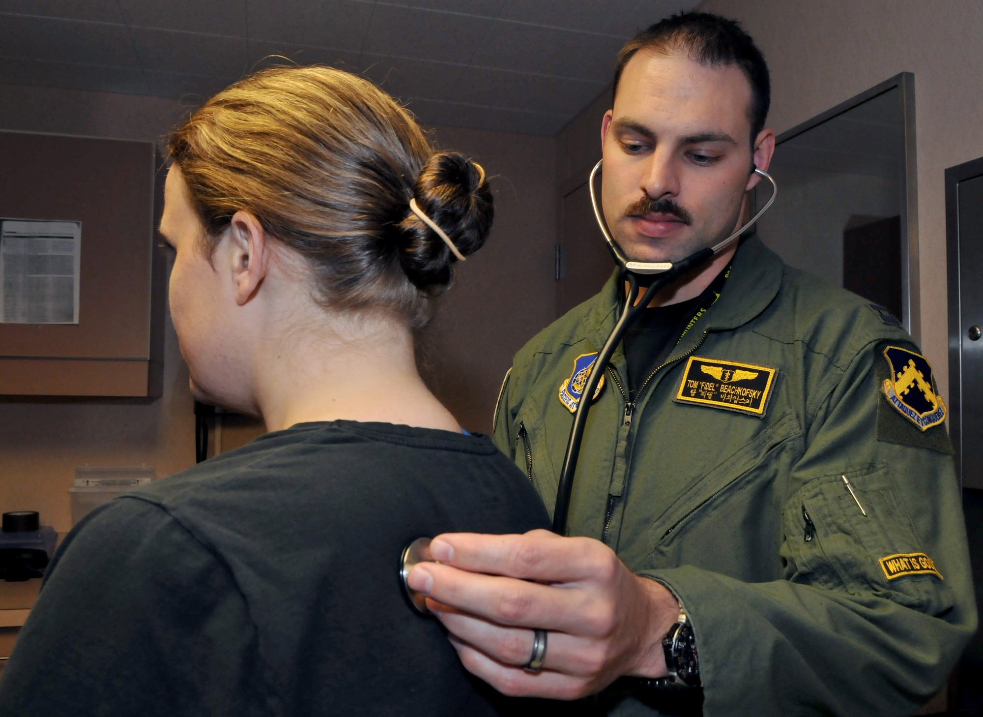 Capt. (Dr.) Tom Beachkofsky, 80th Fighter Squadron flight doctor, performs a flight physical on Capt. Ariane Greenman, 353rd Combat Training Squadron, Eielson Air Force Base, Alaska, before she goes on an incentive flight on a B-52 Stratofortress during Red Flag-Alaska April 22. Red Flag-Alaska is a 10-day field training exercise that provides joint offensive counter-air, interdiction, close air support and large force employment training in a simulated combat environment. (U.S. Air Force photo/Capt. Shannon Collins)
