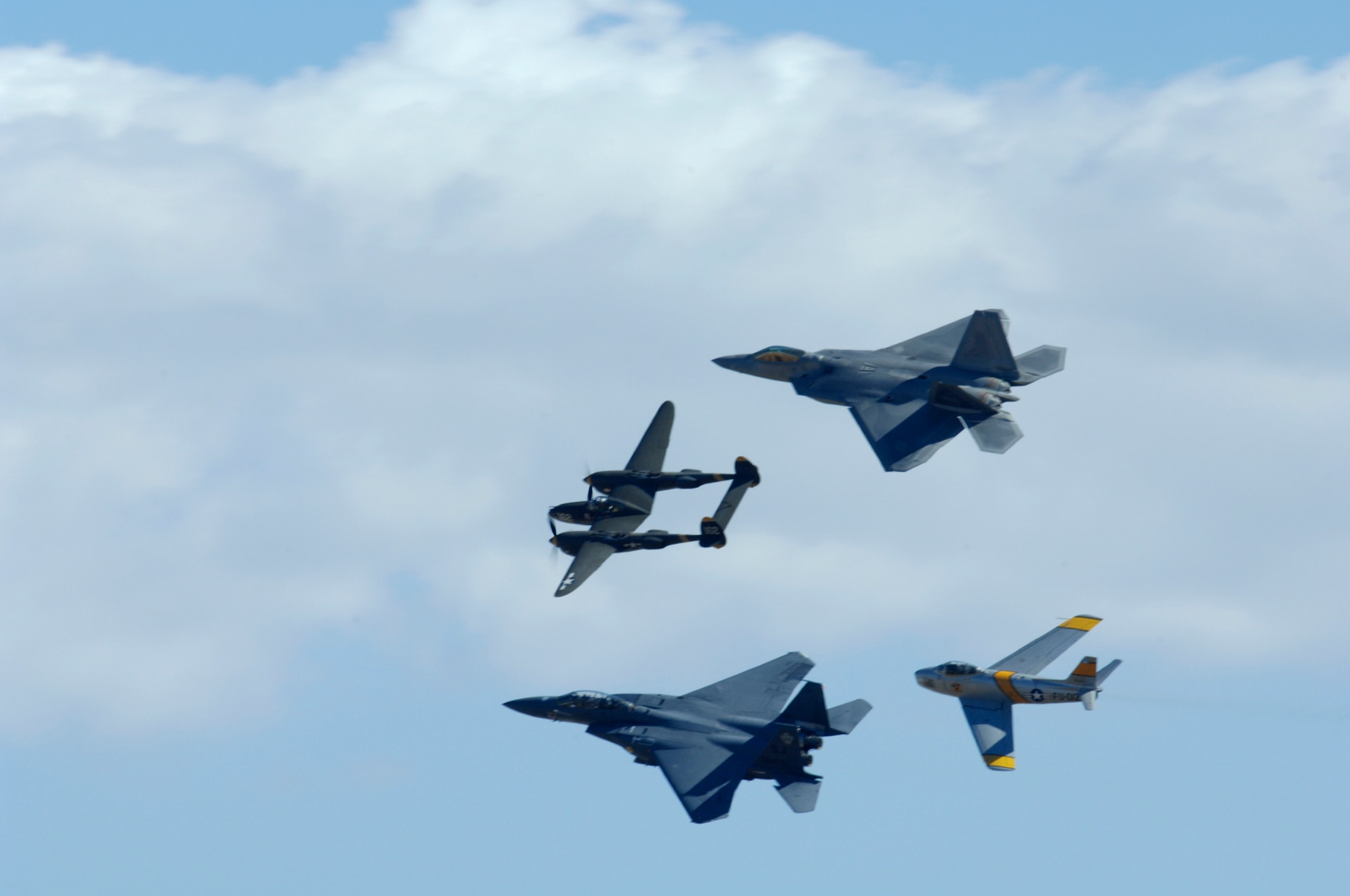 The F-22 Raptor, F-15E Strike Eagle, L-38 Lightning and F-86 Saber fly during the March Field AirFest, March Air Reserve Base, Calif., May 1, 2010. March Field AirFest is a two-day event featuring performances and static displays of civilian and military aircraft. (U.S.  Air Force photo by Senior Airman Matthew Smith/Released)
