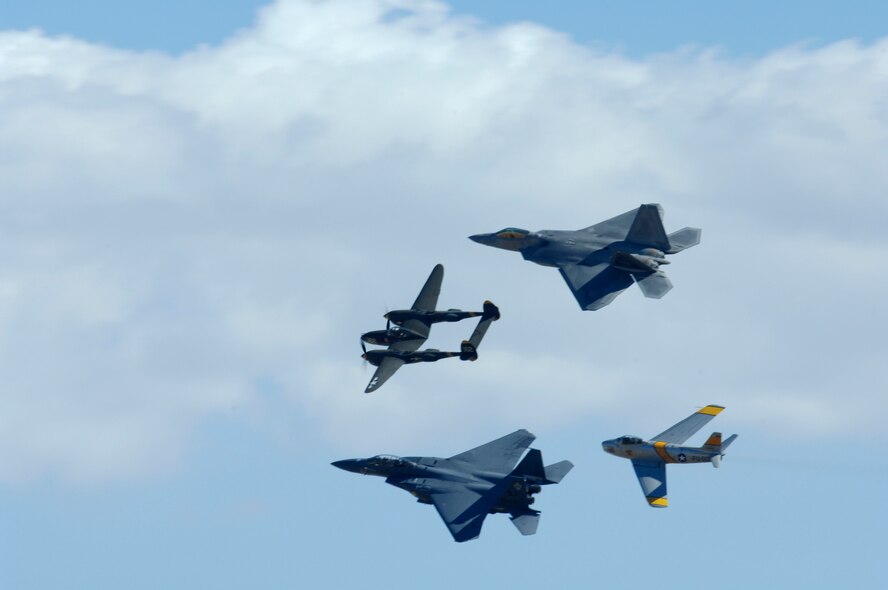 The F-22 Raptor, F-15E Strike Eagle, L-38 Lightning and F-86 Saber fly during the March Field AirFest, March Air Reserve Base, Calif., May 1, 2010. March Field AirFest is a two-day event featuring performances and static displays of civilian and military aircraft. (U.S.  Air Force photo by Senior Airman Matthew Smith/Released)