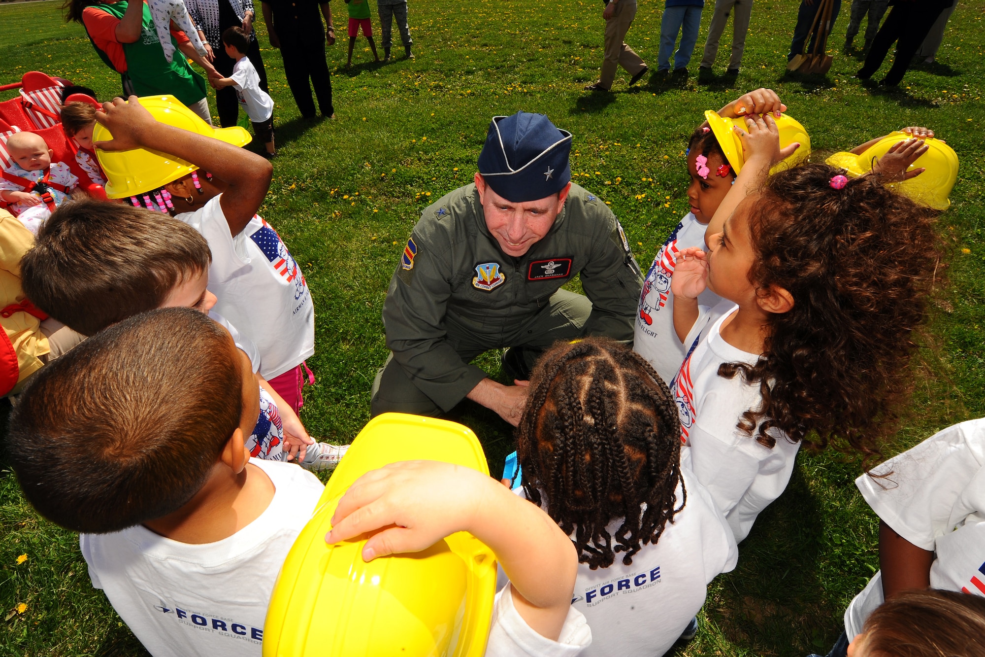 OFFUTT AIR FORCE BASE, Neb. -- Brig. Gen. John N.T. Shanahan, 55th Wing commander, greets the children of Child Development Center II here April 29 prior to planting a Northern Redwood Oak tree in front of the facility in celebration of Arbor Day. Offutt has been named Tree City USA for the last 22 years by the Arbor Day Foundation. U.S. Air Force photo by Josh Plueger