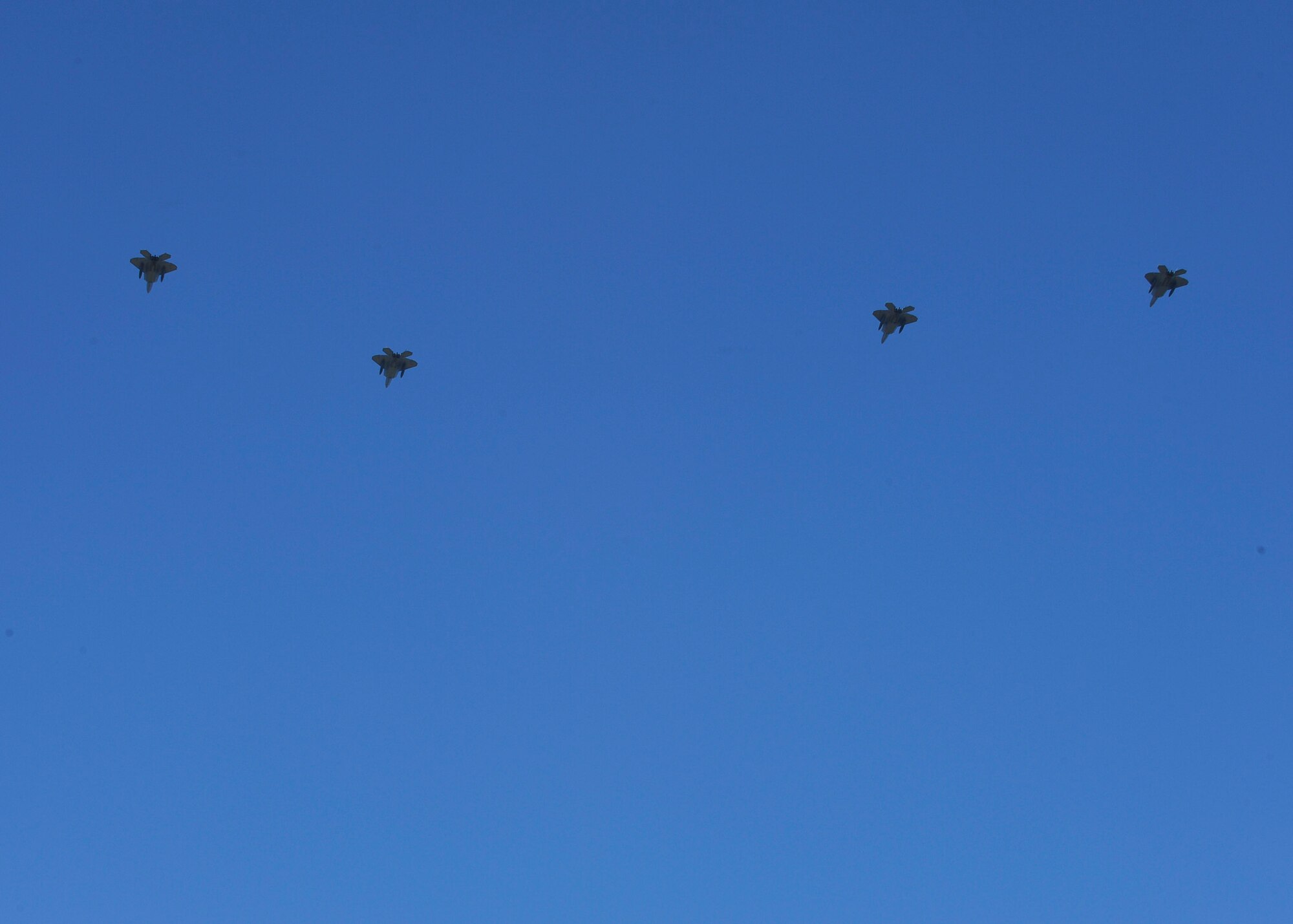LANGLEY AIR FORCE BASE, Va. - F-22 Raptors fly in formation as they depart for Hill Air Force Base, UT to participate in the Combat Hammer exercise May 1.  The exercise will test precision air-to-ground bombing capabilities and prepare air crews for upcoming deployments.  (U.S. Air Force photo/Airman 1st Class Gul Crockett)
