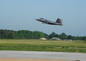 LANGLEY AIR FORCE BASE, Va. - An F-22 Raptor departs for Hill Air Force Base, UT to participate in the Combat Hammer exercise May 1.  The exercise will test precision air-to-ground bombing capabilities and prepare air crews for upcoming deployments.  (U.S. Air Force photo/Airman 1st Class Gul Crockett)