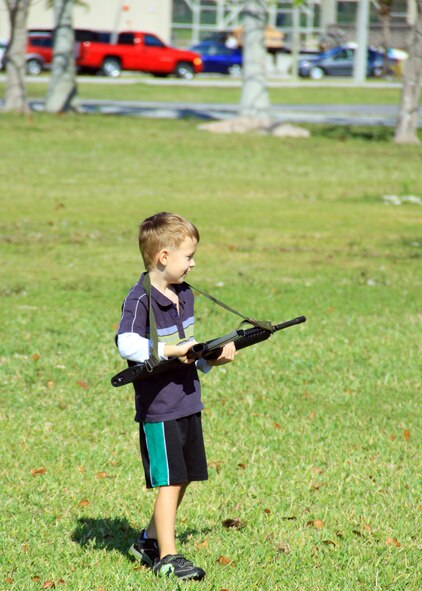 HOMESTEAD ARB, Fla -- Children of Servicemembers from all branches take part in Take Your Child to Work Day, Apr. 22. Several displays were set up near the flightline at Homestead Air Reserve Base. Included were Air Force Explosive Ordnance Disposal equipment, fire trucks from the base, a Coast Guard 25' response boat-small from the Maritime Safety and Security Team, Miami, and parachute demonstrations from Special Operations Command South. Take Your Child to Work Day was founded in 1993 by the Ms. Foundation, originally to offer teenage girls exposure to career options and to help build their self-confidence. (US Air Force Photo/ Ian Carrier)