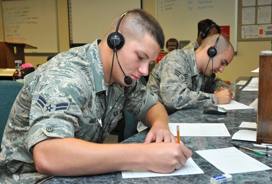 KEESLER AIR FORCE BASE, Miss. -- Airman 1st Class William Oakes, left, and Senior Airman Kyle Brown attend one of the final radio communication operations course to be held in Thomson Hall. More than six decades of Keesler Air Force Base, Miss., history drew to a close July 14, 2009 when the last radio communications operations class in the 336th Training Squadron graduated. The 81st Training Wing has the Air Force’s largest technical training group. The wing trains more than 40,000 students annually for the Air Force and sister services.  Training includes weather, basic electronics, communications electronic systems, communications computer systems, air traffic control, airfield management, command post, air weapons control, precision measurement, education and training, financial management and comptroller, information management, manpower and personnel. (U.S. Air Force photo/Adam Bond)