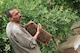 Alahin Aziz Saleh gives local Iraqi women a beekeeping lesson April 12, 2010, in Mazarie South, Iraq. (U.S. Air Force photo/Staff Sgt Quinton Russ)