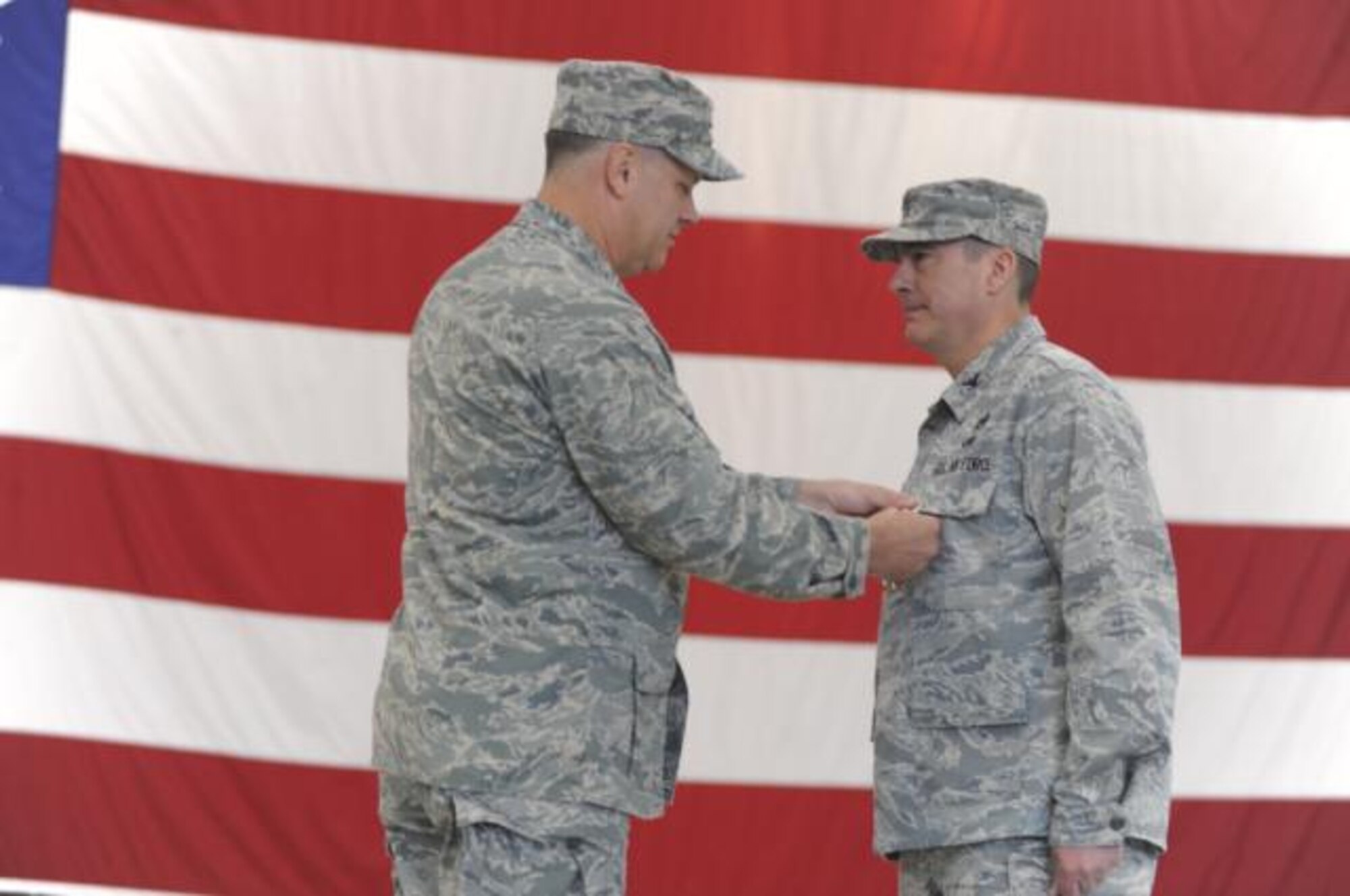 Col. Ricky J. Cornelio was presented the Legion of Merit by Col. Don Shaffer, 319th Air Refueling Wing commander, at a ceremony April 30. Colonel Cornelio also relinquished command of the 319th Maintenance Group at the same ceremony. As the Group Commander he was responsible for organizing, equipping and training the group’s more than 300 person workforce across two squadrons to support and maintain the wing’s 12 KC-135 aircraft. (U.S. Air Force photo by Staff Sgt. Suellyn Nuckolls)