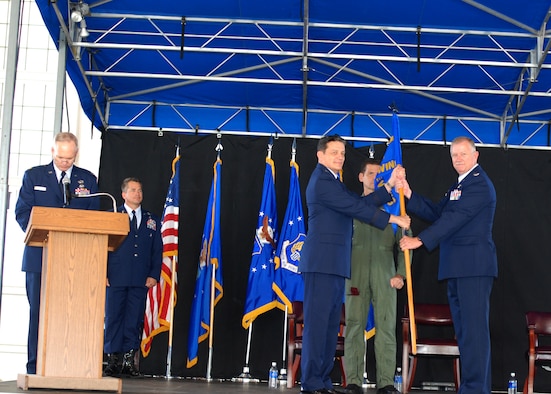 PATRICK AIR FORCE BASE, Fla. -- Colonel Robert L. Dunn receives command of the 920th Rescue Wing from Maj. Gen. Frank J. Padilla, 10th Air Force Commander, May 2 at the 920th Rescue Wing Change of Command Ceremony here. General Padilla commented about the utmost confidence he has in Colonel Dunn to lead the Wing as he spoke about Colonel Dunn's career and accomplishments. Colonel Dunn was previously the Commander of the 943rd Rescue Group at Davis-Monthan AFB, Ariz., one of the 920th Geographically Separated Units (GSU.) Colonel Dunn assumes command of the 920th from Colonel Steven W. Kirkpatrick, who now begins his new job as the senior Air Force Reserve Adviser to the Commander of U.S. Special Operations Command at MacDill AFB, Fla. (U.S. Air Force photo/Staff Sgt. Leslie Kraushaar)