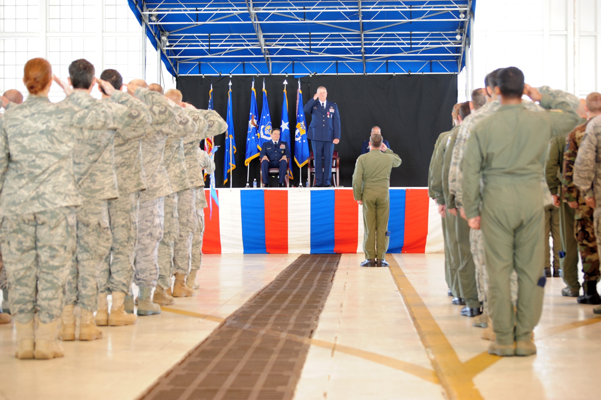 PATRICK AIR FORCE BASE, Fla. -- Colonel Robert L. Dunn, commander of the 920th Rescue Wing, receives his first salute from Wing Airmen after assuming command of the Wing from Colonel Steven W. Kirkpatrick during a May 2 Change of Command ceremony in Hangar 750 here. Colonel Dunn was previously the Commander of the 943rd Rescue Group at Davis-Monthan AFB, Ariz., one of the 920th Geographically Separated Units (GSU.) Colonel Kirkpatrick now begins his new job as the senior Air Force Reserve Adviser to the Commander of U.S. Special Operations Command at MacDill AFB, Fla. (U.S. Air Force photo/Master Sgt. Rob Grande)