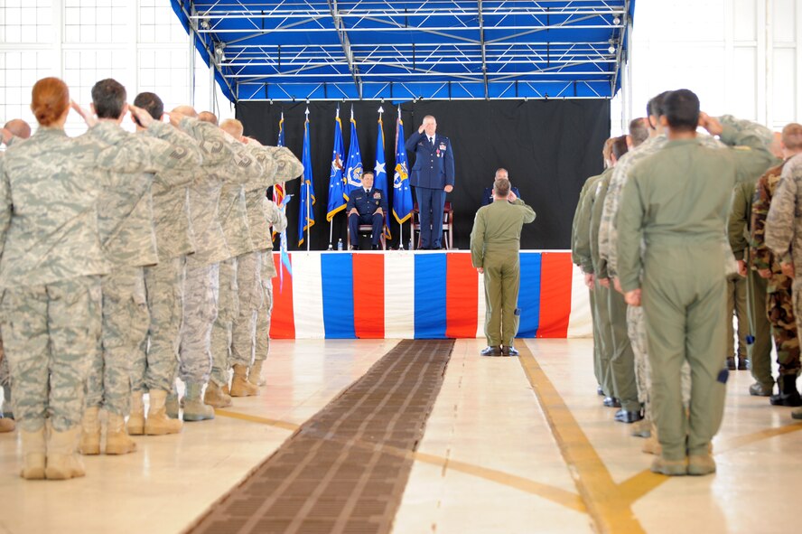 PATRICK AIR FORCE BASE, Fla. -- Colonel Robert L. Dunn, commander of the 920th Rescue Wing, receives his first salute from Wing Airmen after assuming command of the Wing from Colonel Steven W. Kirkpatrick during a May 2 Change of Command ceremony in Hangar 750 here. Colonel Dunn was previously the Commander of the 943rd Rescue Group at Davis-Monthan AFB, Ariz., one of the 920th Geographically Separated Units (GSU.) Colonel Kirkpatrick now begins his new job as the senior Air Force Reserve Adviser to the Commander of U.S. Special Operations Command at MacDill AFB, Fla. (U.S. Air Force photo/Master Sgt. Rob Grande)