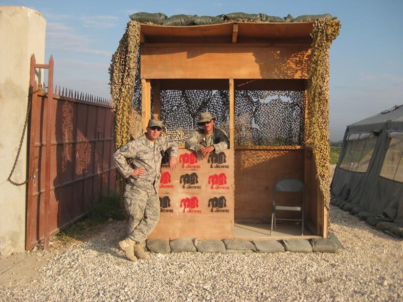PORT-AU-PRINCE, Haiti -- Master Sgt. Todd Cooper, 823rd Expeditionary Security Forces Squadron flight sergeant, stands with fellow “Jester” Tech. Sgt. Jonothon McGuire at an entry control point guard shack here in early May. Sergeant Cooper was one of the original 184 security forces members sent to provide security in the earthquake-devastated capital of Haiti. (Contributed photo/RELEASED)