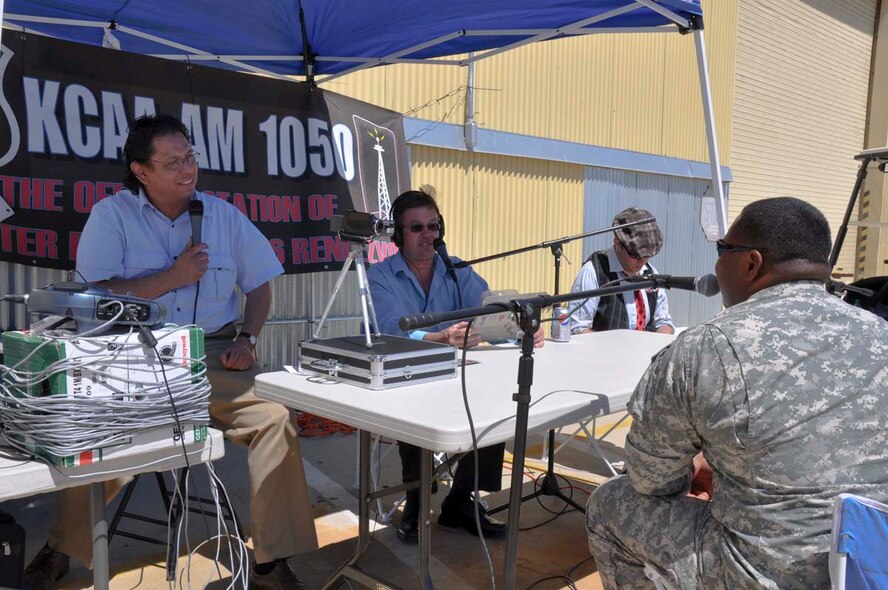 America's Army Real Hero Sgt. Jason Mike, traveling with the Virtual Army Experience, responds to questions during a radio interview at the March Field AirFest at March Air Reserve Base, May 1, 2010.  Two local radio stations present at the two-day, bi-annual event interviewed 14 AirFest performers.  (U.S. Air Force photo/1st Lt. Zach Anderson)