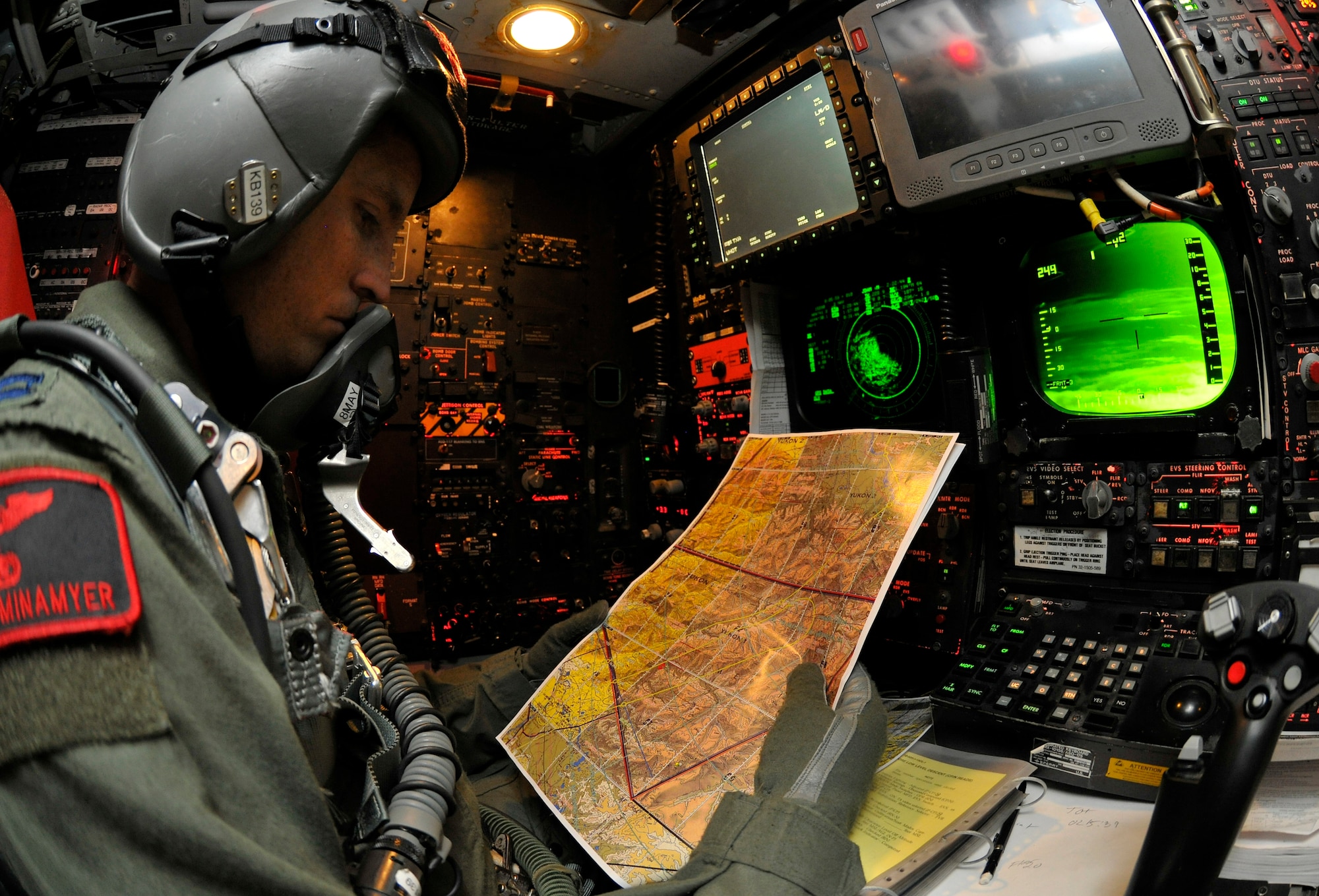 Capt. Michael Minameyer reviews map during a RED FLAG-Alaska 10-2 sortie on a B-52H Stratofortress, April 29, 2010, Eielson Air Force Base, Alaska. RF-A provides participants 67,000 square miles of airspace, more than 30 threat simulators, one conventional bombing range and two tactical bombing ranges containing more than 400 different types of targets. Captain Minameyer is a navigator assigned to the 96th Bomb Squadron, Barksdale AFB, Louisiana. (U.S. Air Force photo/Staff Sgt. Christopher Boitz)