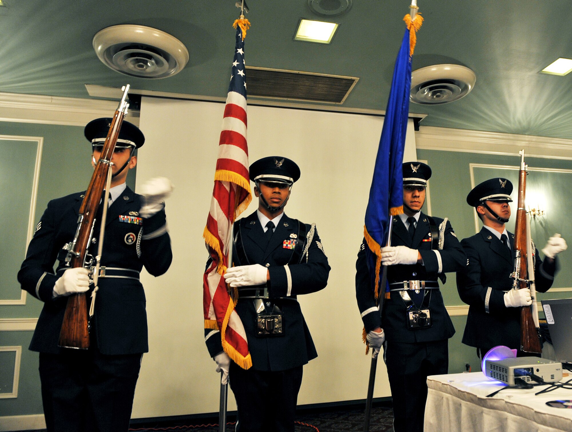OFFUTT AIR FORCE BASE, Neb. -- Members of the Offutt Honor Guard post the colors during the Volunteer Appreciation Reception at the Patriot Club here April 28. More than 80 people from various organizations on and off-base attended the event to honor the contributions of Offutt's many volunteers. U.S. Air Force photo by Charles Haymond