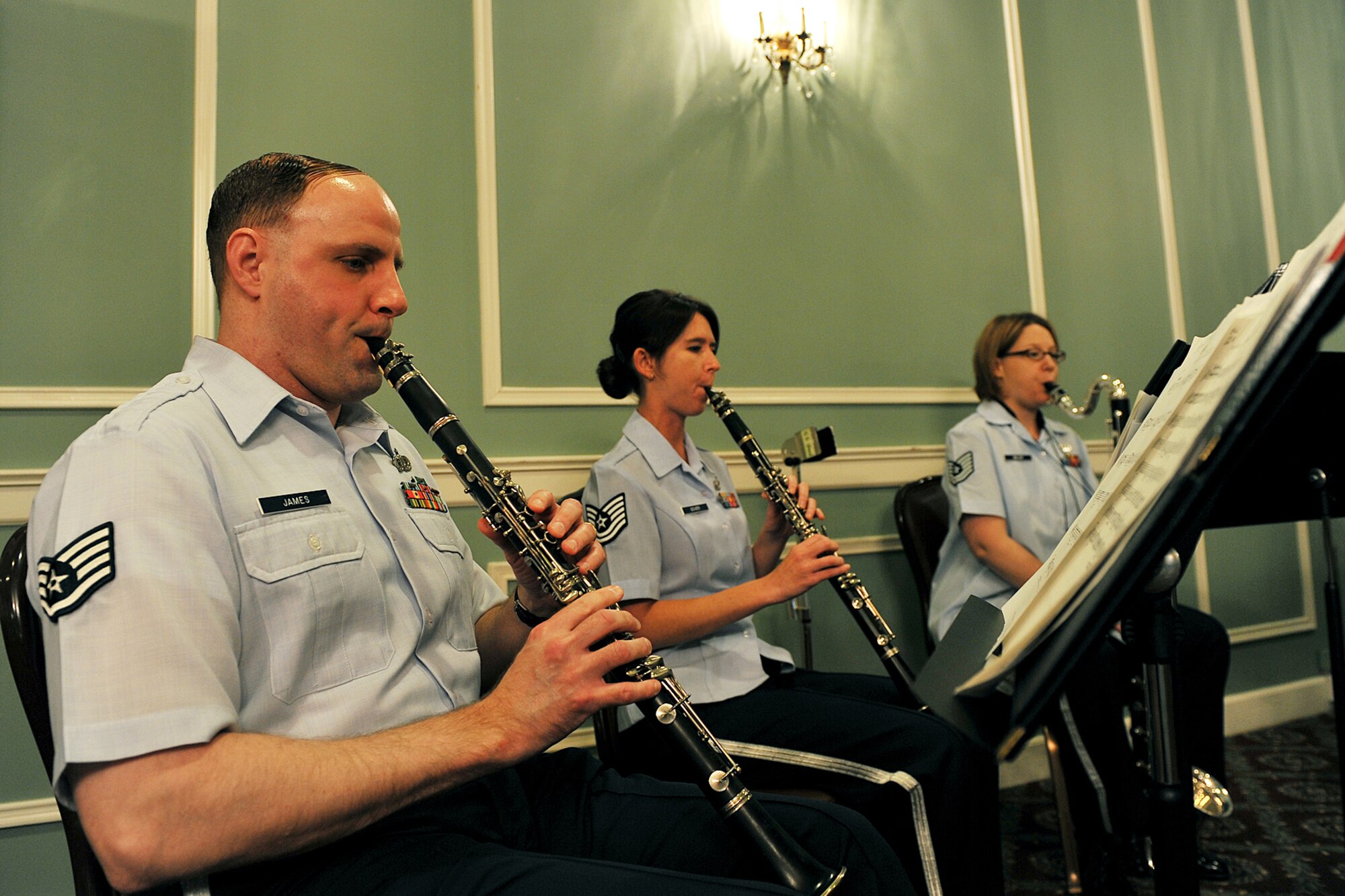 OFFUTT AIR FORCE BASE, Neb. -- Staff Sgt. Clive James, a clarinetist with the  Heartland of America Band's New Horizons Clarinet Ensemble, performs at the Patriot Club here April 28 before the Volunteer Appreciation Reception. More than 80 people from various organizations on and off-base attended the event to honor the contributions of Offutt's many volunteers. U.S. Air Force photo by Charles Haymond
