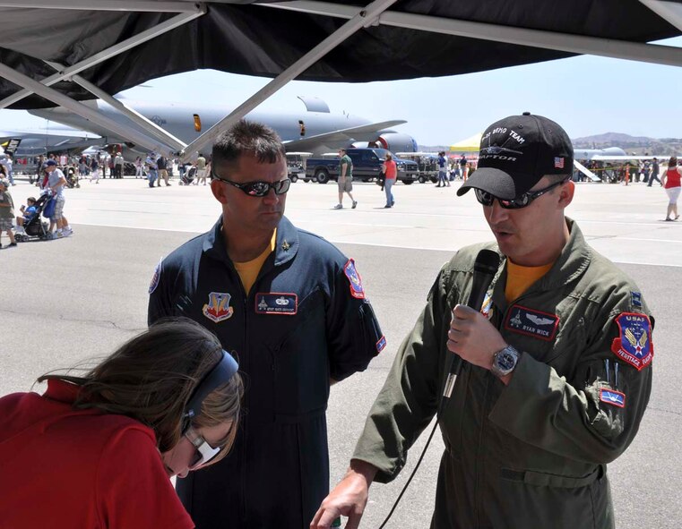 Capt. Ryan Wick and Master Sgt. Greg Gappert, F-22 Raptor Demonstration team, respond to questions during a radio interview at the March Field AirFest at March Air Reserve Base, May 1, 2010.  Two local radio stations present at the two-day, bi-annual event interviewed 14 AirFest performers.  (U.S. Air Force photo/1st Lt. Zach Anderson)