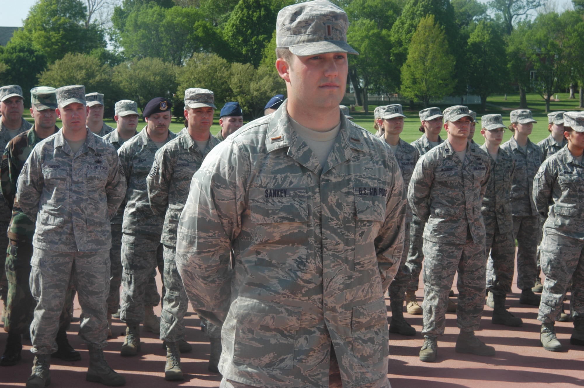 OFFUTT AIR FORCE BASE, Neb. -- 2nd Lt. Alec M. Sankey, 55th Comptroller Squadron, stands at parade rest along with several members of the 55th Wing during a retreat ceremony at the parade grounds here April 29. The ceremony signifies the end of the duty day. U.S. Air Force photo by Staff Sgt. James M. Hodgman