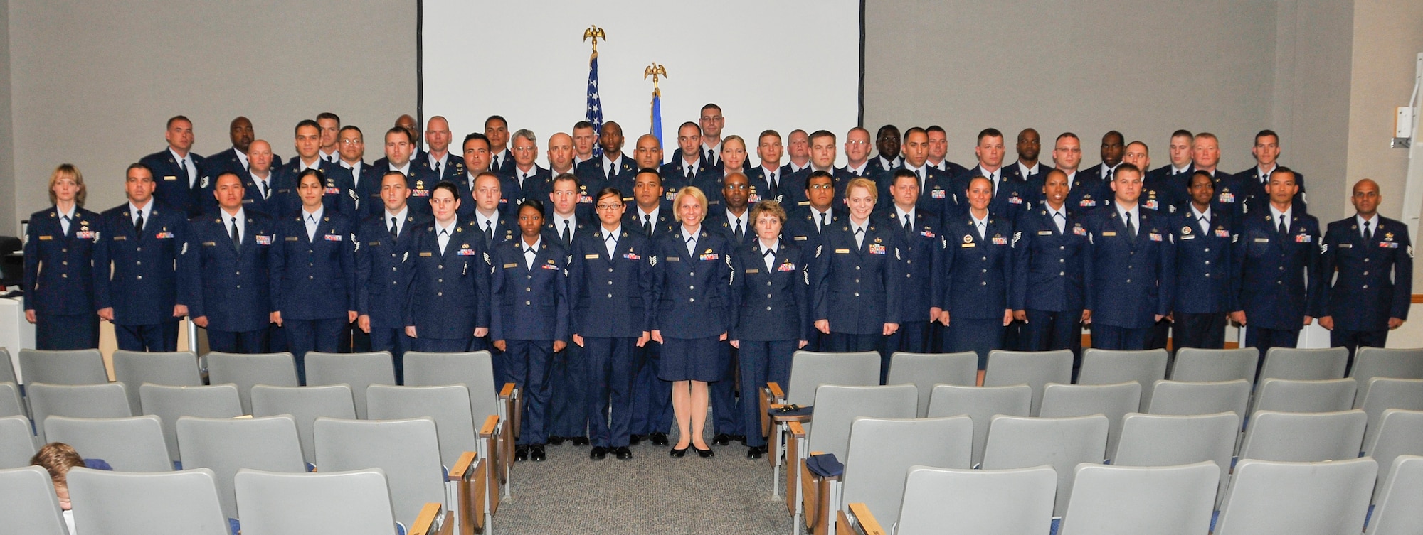 Community College of the Air Force students gather for their April 28 graduation at the 325th Air Control Squadron auditorium. (U.S. Air Force photo by Airman 1st Class Rachelle Elsea)