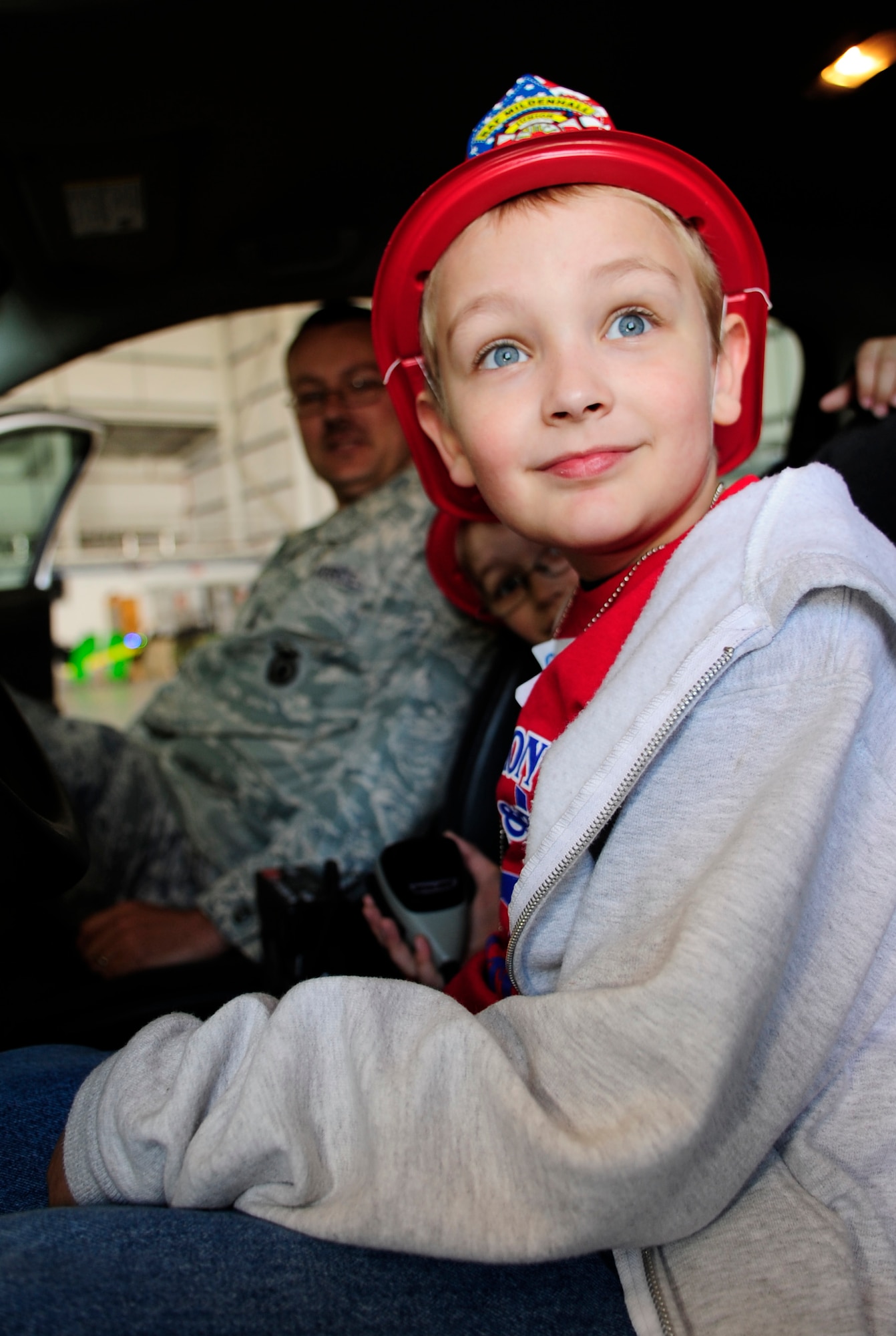 RAF MILDENHALL, England – Zachary Oxendale tries out the siren on a police cruiser during Operation Together and Ready May 1.  Almost 200 children attended the event that gave them a glimpse their parents military career.  (U.S. Air Force photo/Staff Sgt. Christopher L. Ingersoll)
