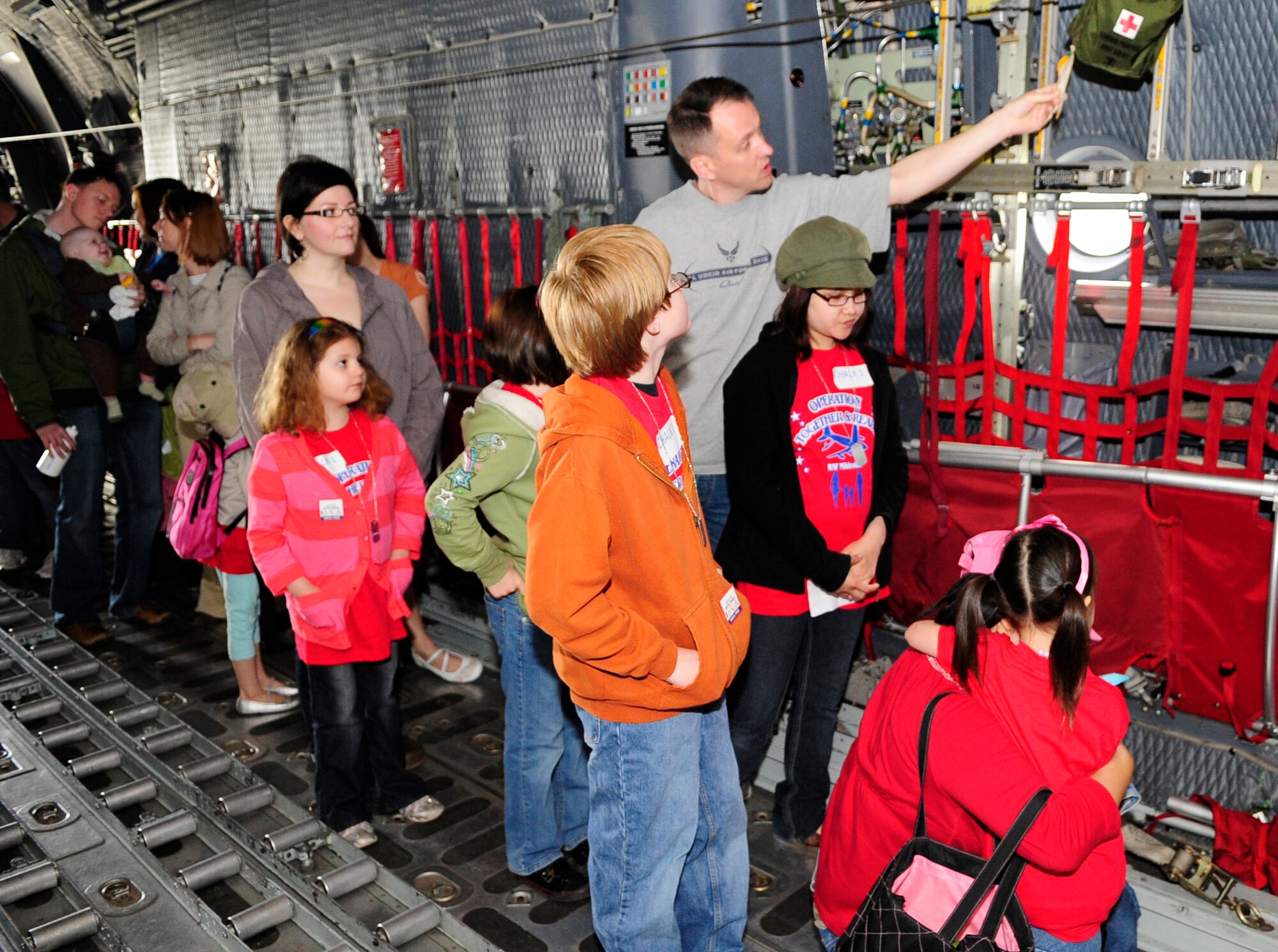 RAF MILDENHALL, England – Children and their parents file through a static aircraft display during Operation Together and Ready May 1.  The display was one of several at the event which was attended almost 200 children.  (U.S. Air Force Photo/Staff Sgt. Christopher L. Ingersoll)