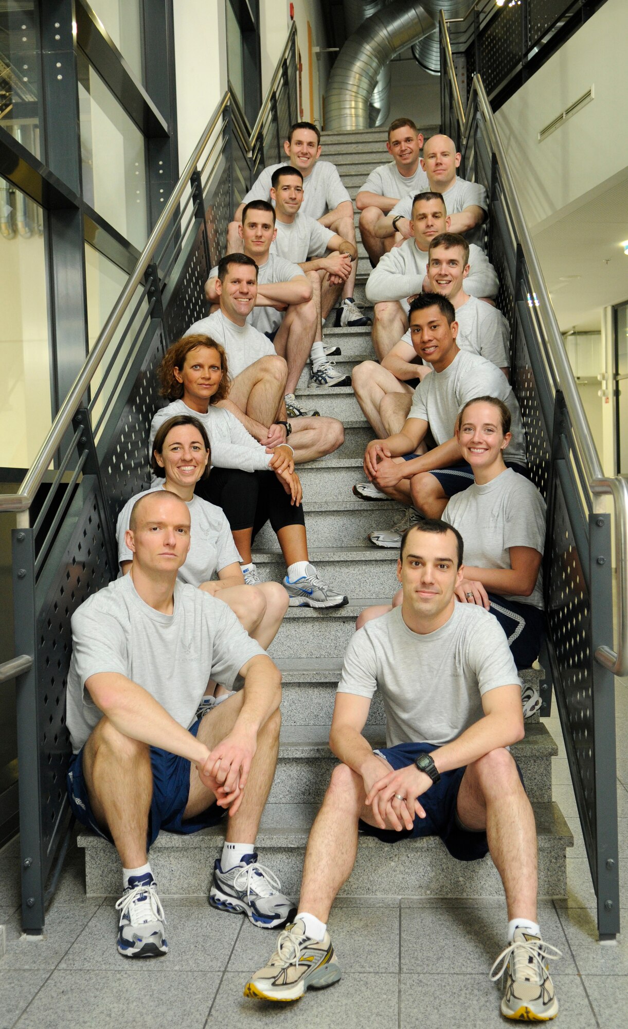 U.S. Air Force service members pose for a photo, South Side Fitness Center, Ramstein Air Base, Germany, May 3, 2010. The Airmen were recognized for achieving a perfect score of 100 per cent on their physical assessment test for the month of April. (U.S. Air Force photo by Airman 1st Class Brittany Perry)
